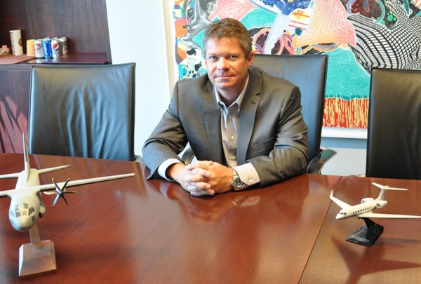 Haskell's Paul Raudenbush sitting at a table.