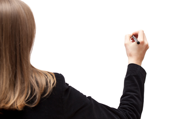 Woman writing on whiteboard.