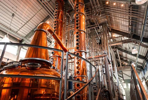 Interior of distillery with copper pot and column stills