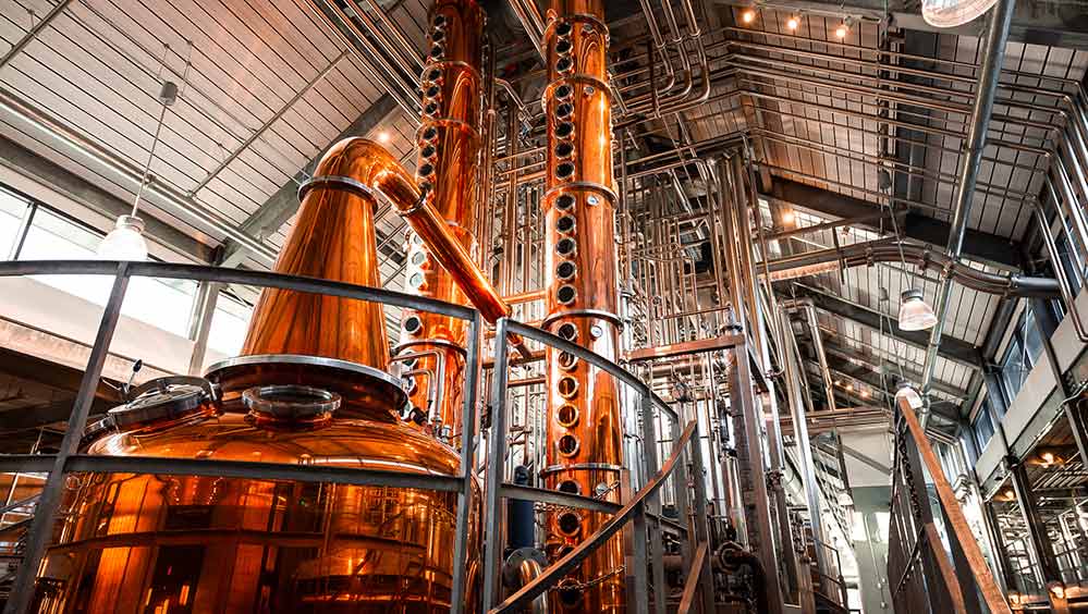 Interior of distillery with copper pot and column stills