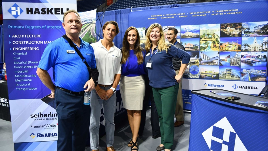 Haskell employees pose at college career fair.