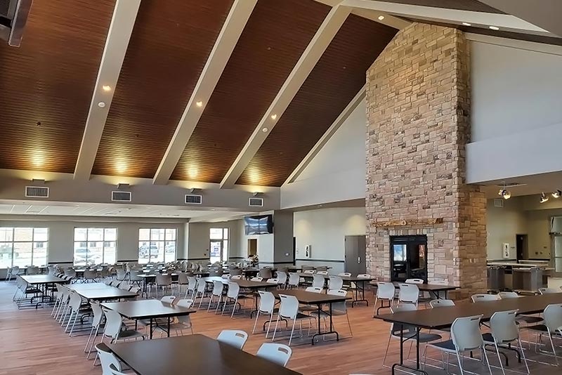 Dining Facility interior with stone fireplace