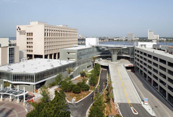 Exterior photo of Baptist Heart Hospital. Streets leading into entrance and parking garage.