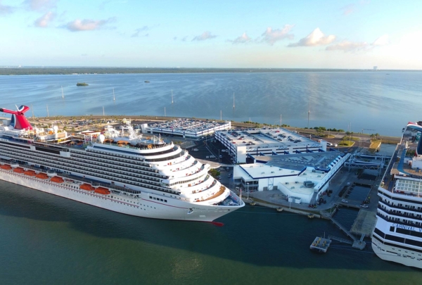 Aerial photo of the Canaveral Port Authority Cruise Terminal 5. Two cruise ships in port at the updated terminal.