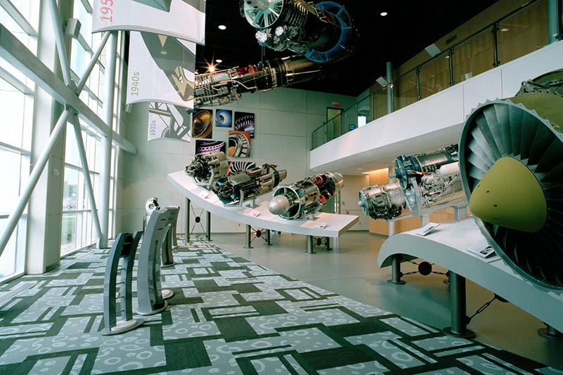 Inside the lobby of the GE Aviation Learning Center with sculptures surrounding the entryway.