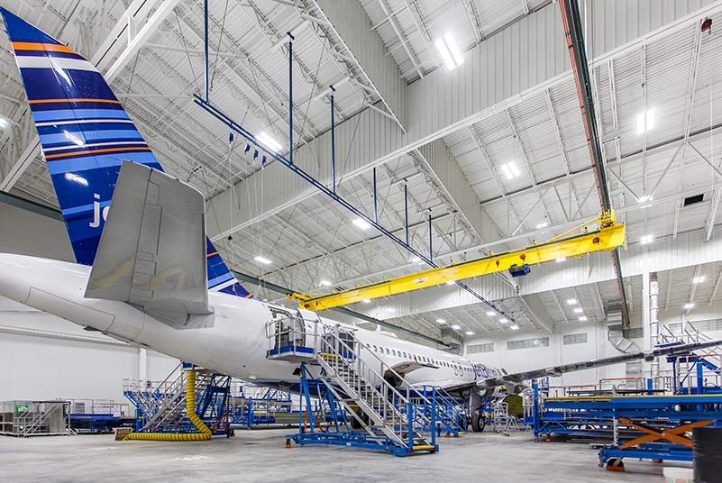 Airplane sitting inside Lufthansa Technik Heavy Maintenance Facility.