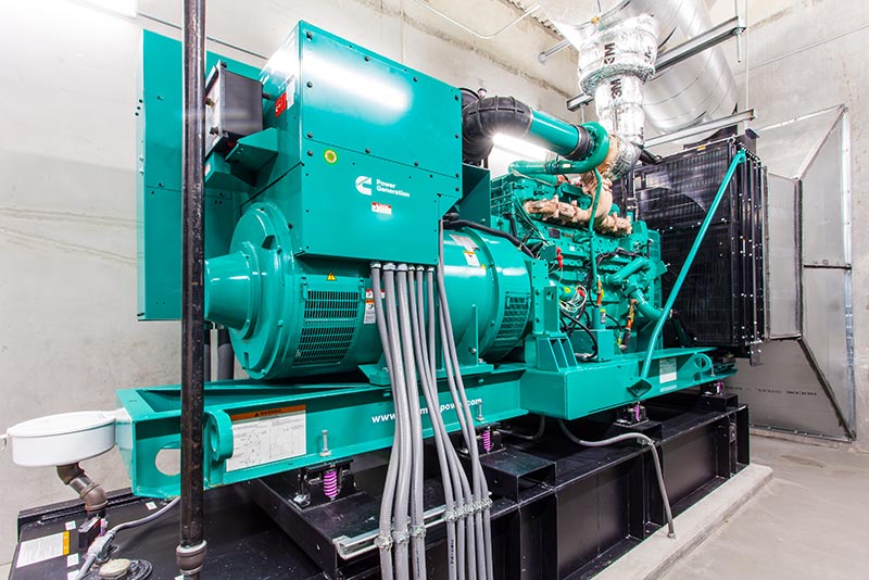 Photo from inside the central energy plant. Aqua colored generator.