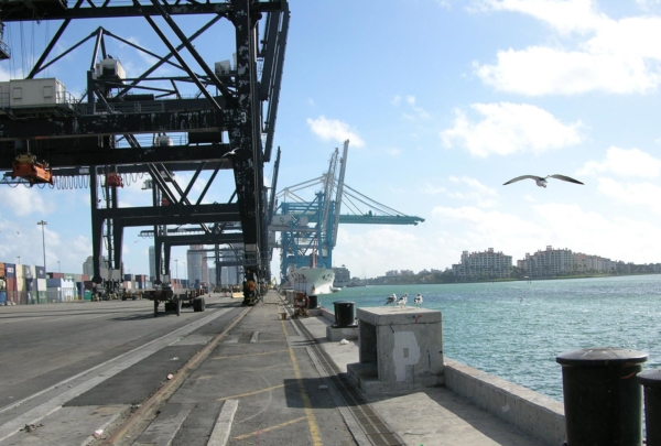 Photo of Port of Miami. Cargo side of the port. Container loaders.