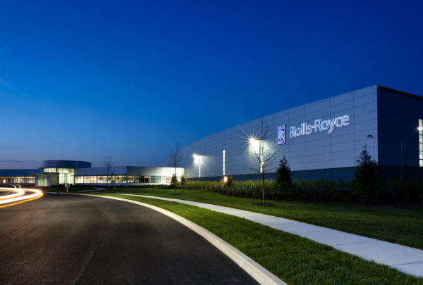 Exterior of Rolls Royce Crosspointe Rotatives Facility in the evening with street lamps on.