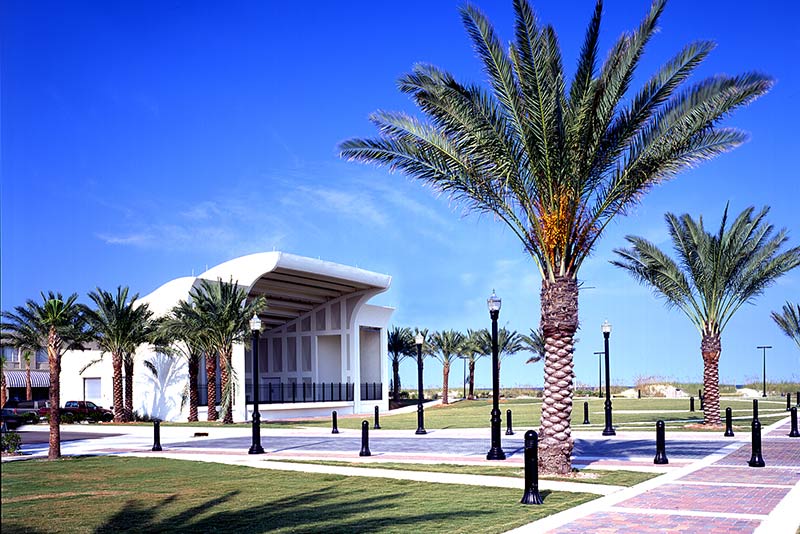Exterior photo of Sea Walk Pavilion. Palm trees line either side of the venue. Brick sidewalks lead all around the location.