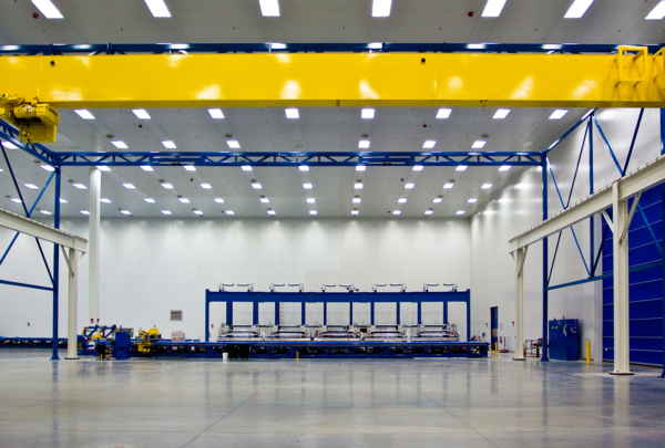 Interior of Spirit AeroSystems Composite Center. Large open room with fluorescent lighting.