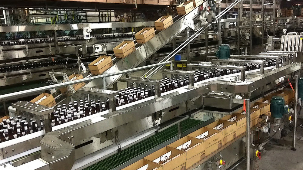Bottles and boxes on packaging line.