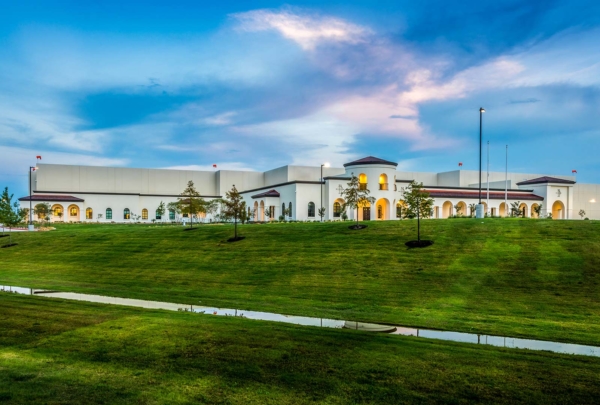 Facility exterior at dusk.