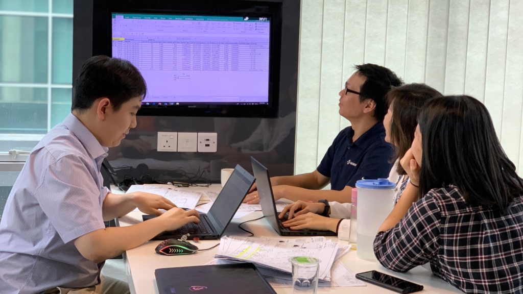 Haskell Malaysia employees viewing data displayed during a project meeting