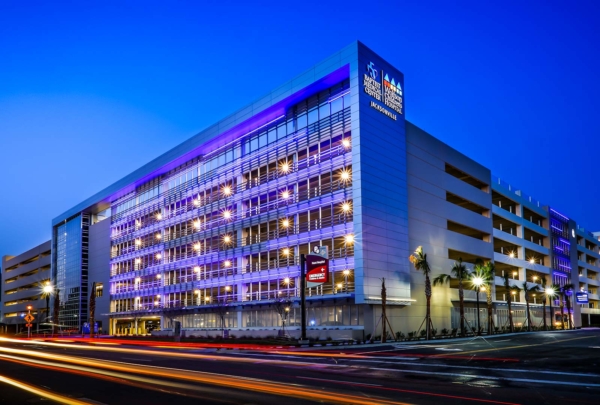 Exterior photo of Baptist parking structure at night.