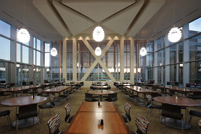 Dining Room with high ceiling and glass walls on all sides