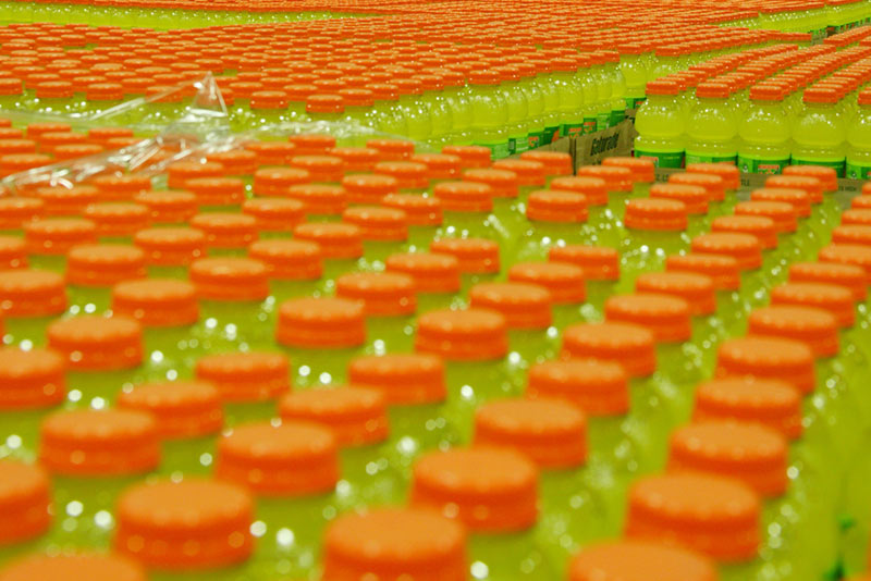 Hundreds of bottles of Gatorade arranged neatly in corrugated trays