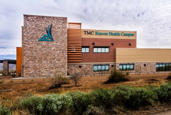 Exterior photo of TMC Rincon Health Campus in the desert. Natural earth tones were used on the exterior finishes