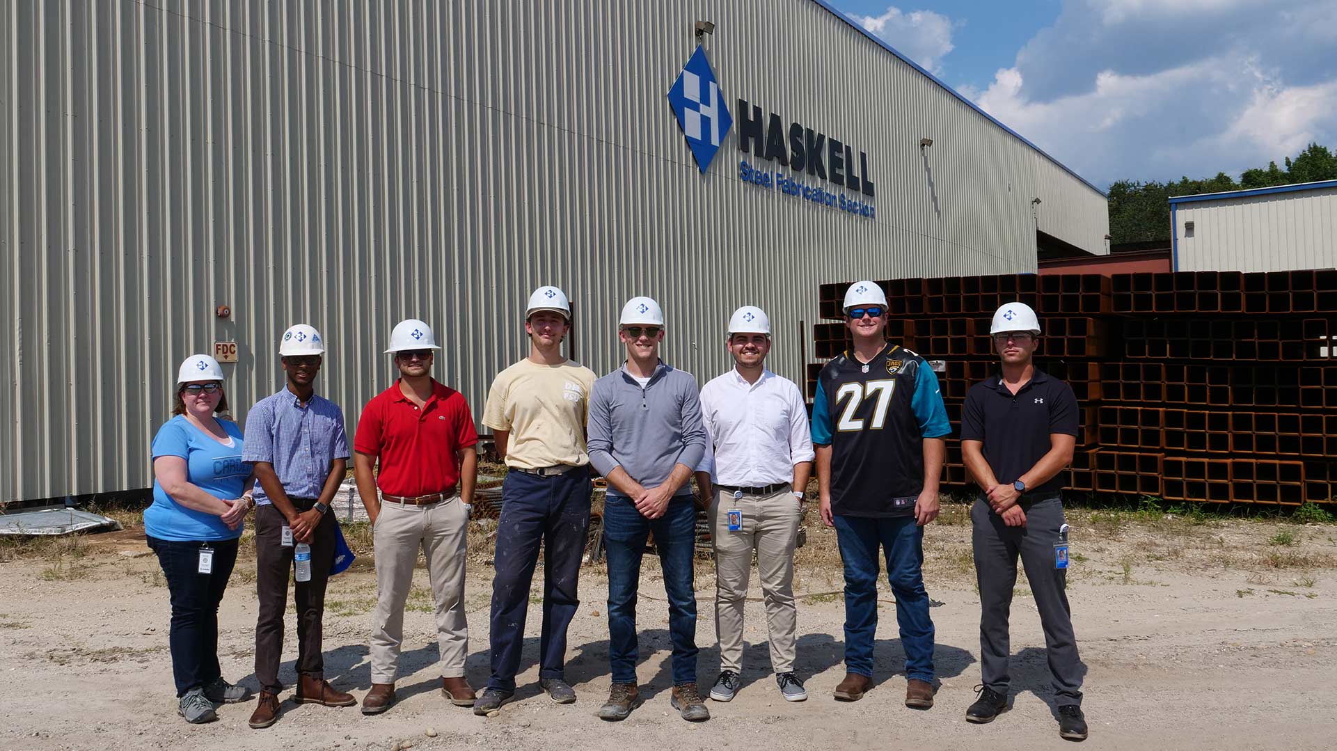 College interns visiting Haskell's steel shop.