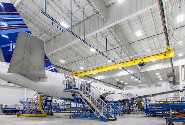 Airplane sitting inside Lufthansa Technik Heavy Maintenance Facility.