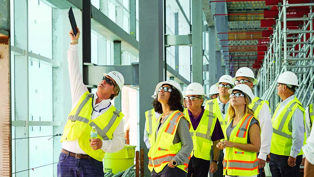 People touring a construction site.