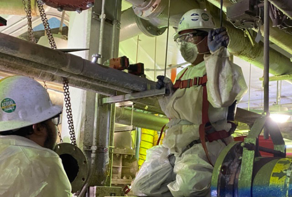 Engineers working wearing PPE.