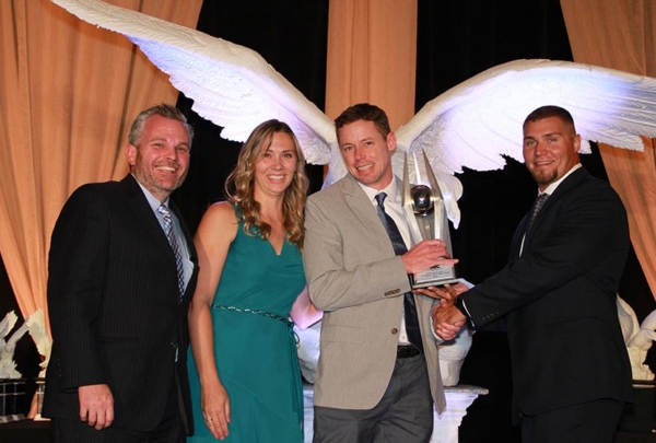 Project team posing with awards.