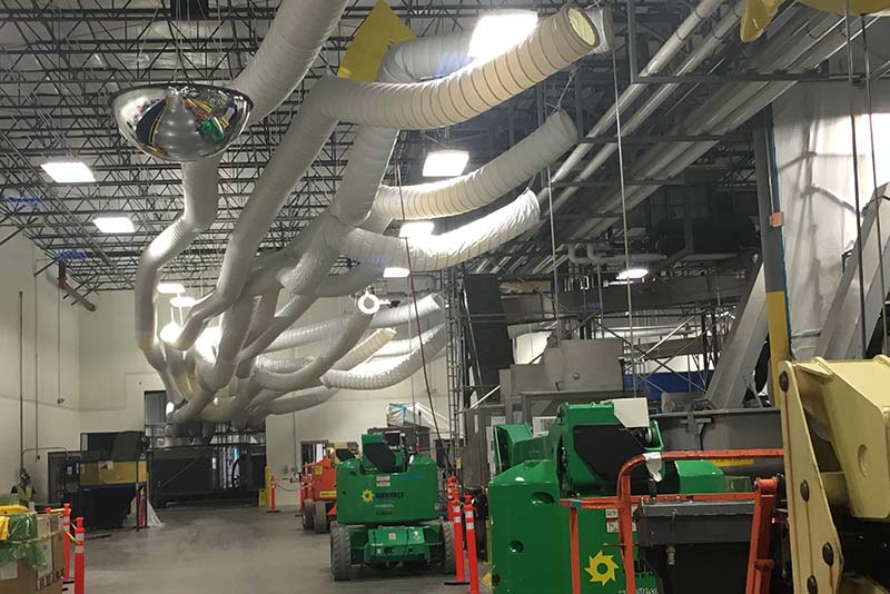 To expedite production, Haskell ran temporary ductwork throughout the water bottling process area. Haskell Project Manager Chad Kunkel said this “spaghetti” piping could have created access issues but credits his scaffolding specialists for their ability to erect and dismantle scaffolding even in tight spaces.