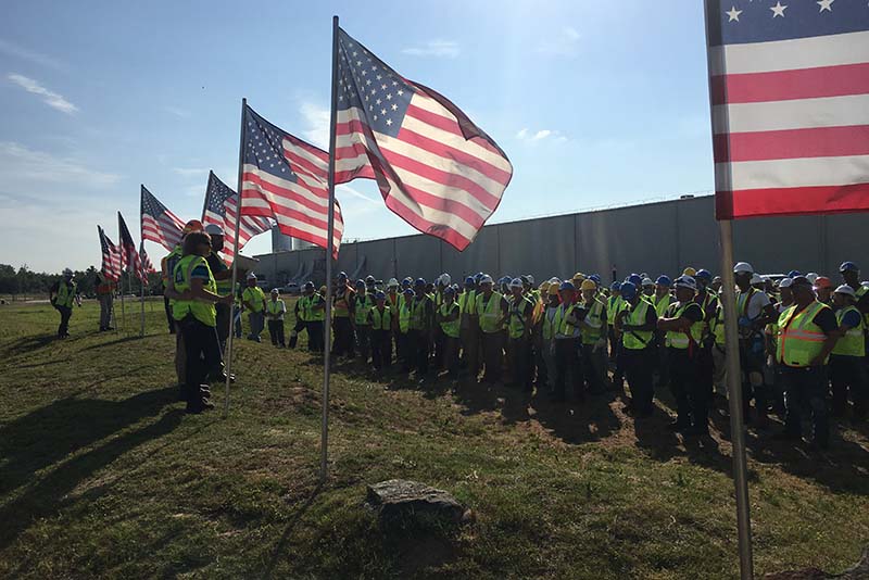Haskell safety professionals share a message with crews before work begins for the day. To restore Nestle’s seven bottling lines, day and night crews worked seven days a week, peaking on July 12 with 432 workers onsite.