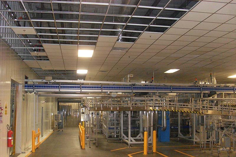 Ceiling damage extended across the facility’s key production and processing areas. To expedite the line restoration effort, Haskell installed temporary ceilings and protection. Once production resumed, crews worked double shifts to install permanent ceilings where damage had occurred.