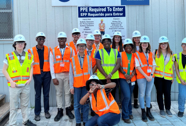 The 14 members of Haskell’s High School Internship Program, who visited five projects during the six-week curriculum, pose for a photo outside the jobsite trailer at the JEA H2.0 Purification project.