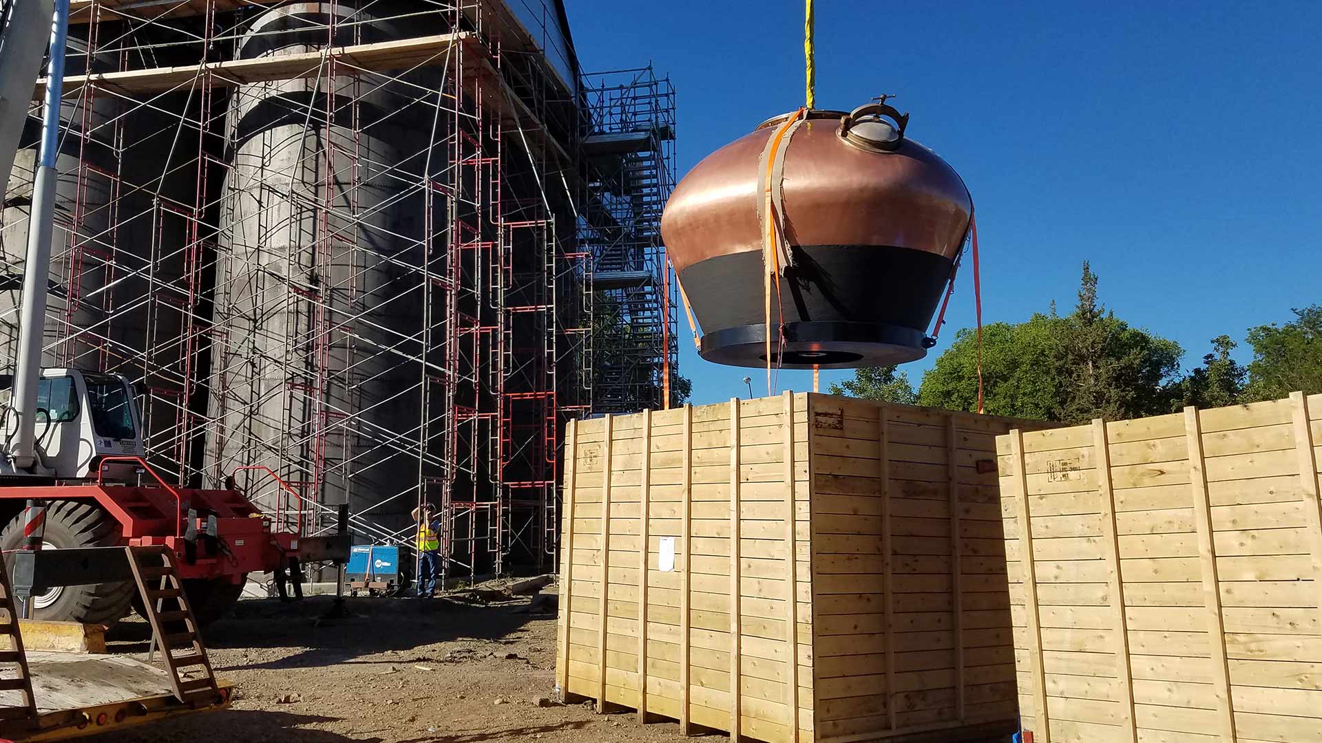 Distillery equipment under construction.|