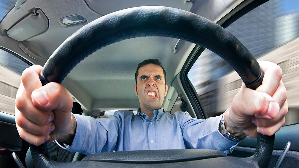 Angry man stuck in traffic|