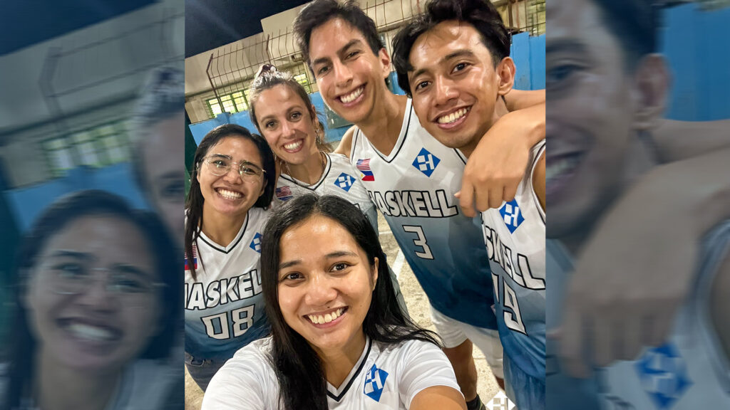 Alyssa Gemal, front, takes a selfie of herself with, from left, Retchel Ogdamen, Heline Filhol, Erik Obando and Hanz Rebustillo. The Haskell team members frequently cheer on their company-sponsored recreation league basketball team.