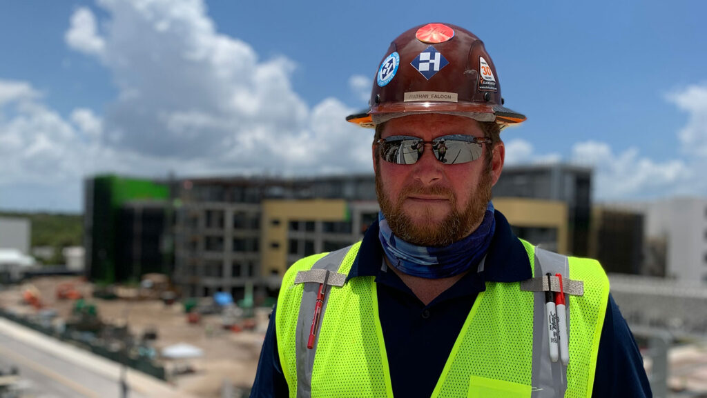 Haskell's Nathan Faloon standing on a jobsite.|