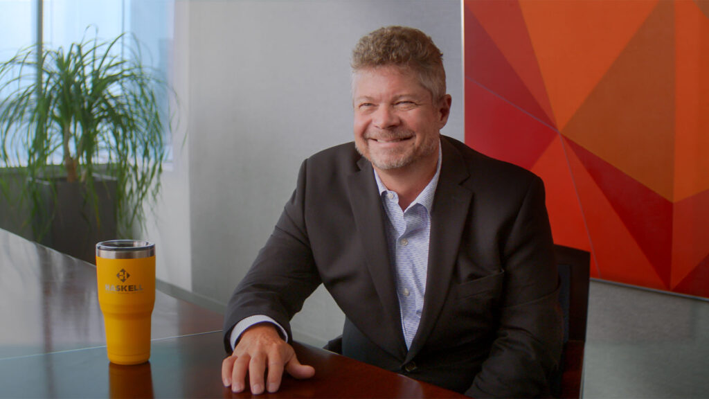 |Haskell's Paul Raudenbush sitting at a table.|