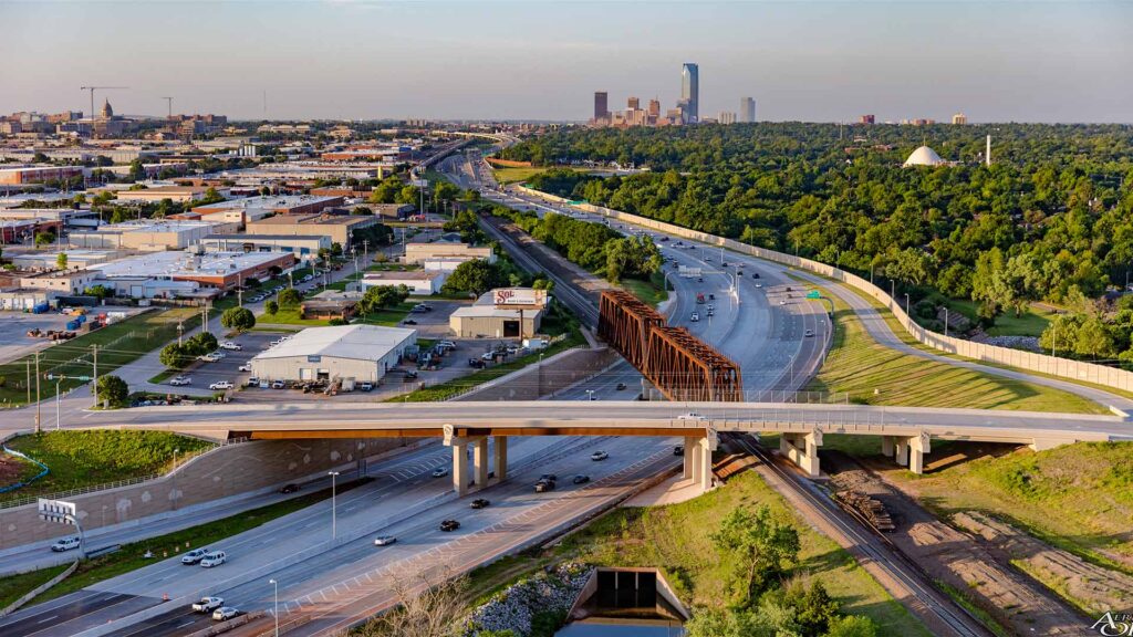 Aerial view of I-235 Broadway Extension Corridor project adjacent to Central Business District|I-235 Broadway Extension Looking Northeast at BNSF Railroad Truss and 50th Street||
