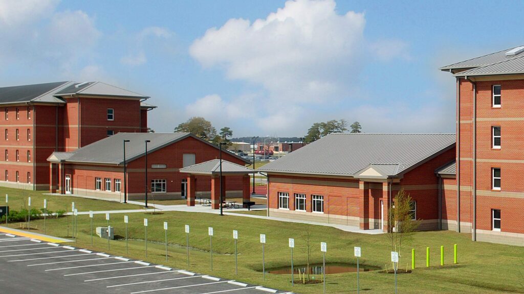 Exterior photo of Cherry Point Bachelor Enlisted Quarters|Federal Blue Background|