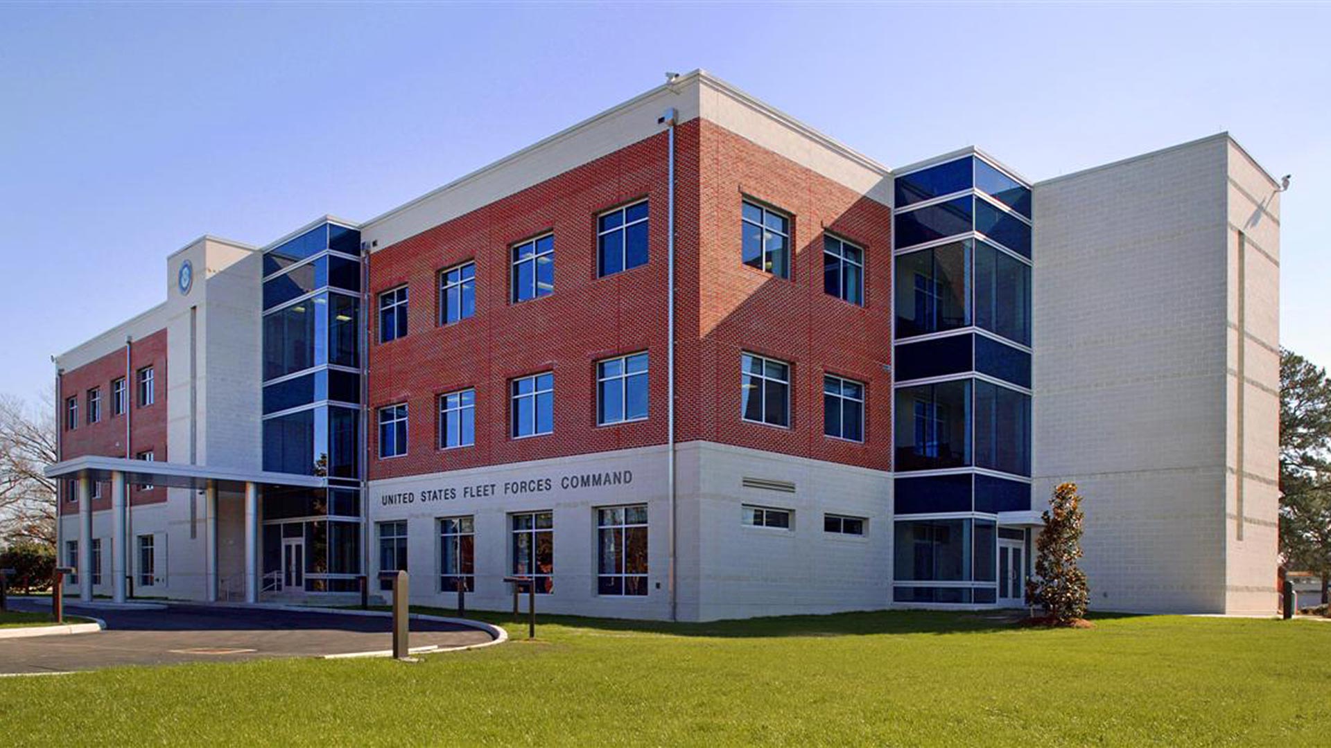 Exterior of U.S. Fleet Forces Command HQ building|Skylight detail photo|Conference Room|Elevator Lobby featuring Fleet Forces Command emblem inset in terrazzo floor|Exterior of U.S. Fleet Forces Command HQ building|||||