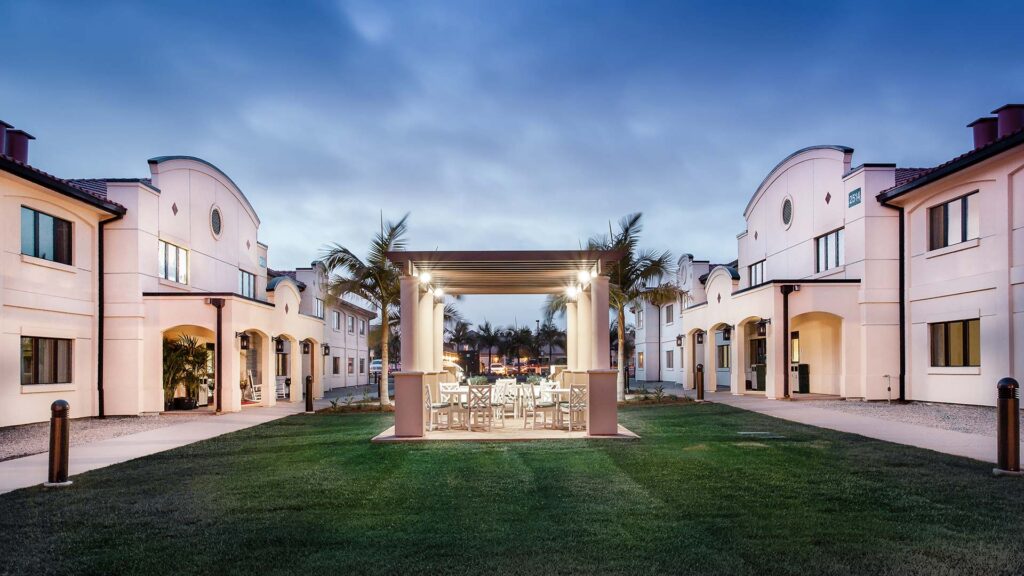 Miramar Inn lawn and picnic area at dusk|Miramar Inn lawn and picnic area at dusk|One bedroom suite with living area