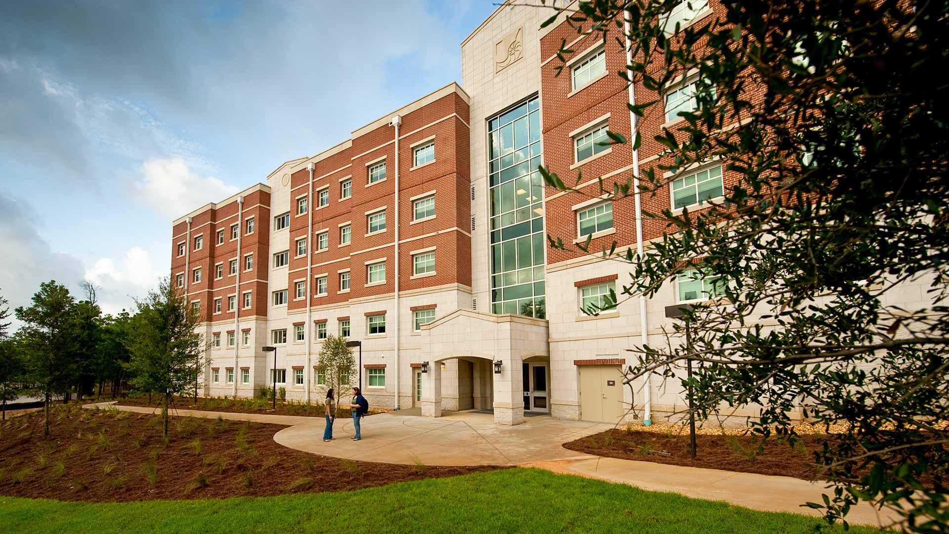 Exterior photo of Heritage Hall campus residence building|Photo of student housing kitchenette|Exterior photo of Heritage Hall campus residence building|Exterior photo of Heritage Hall campus residence building||||