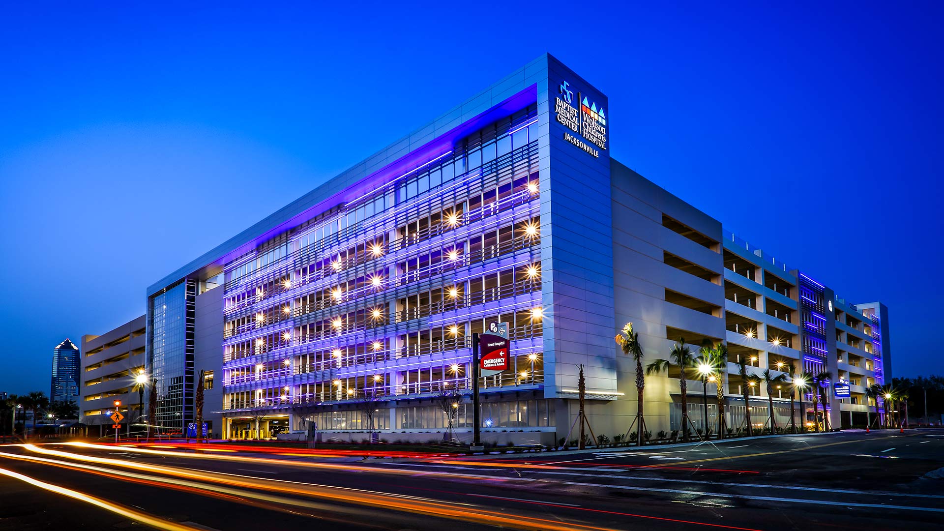 Exterior photo of Baptist parking structure at night.|Exterior photo of Baptist parking structure during the day|Exterior photo of Baptist parking structure at dusk|Photo of the elevators and signs within the Baptist Medical center parking structure|Photo of handicap parking spaces on the ground level of the parking structure|Photo of a stairwell within the Baptist Medical Center parking structure|Photo from Level 7 top floor parking lot of the Baptist parking structure.|Exterior photo of Baptist parking structure at night.||||||||