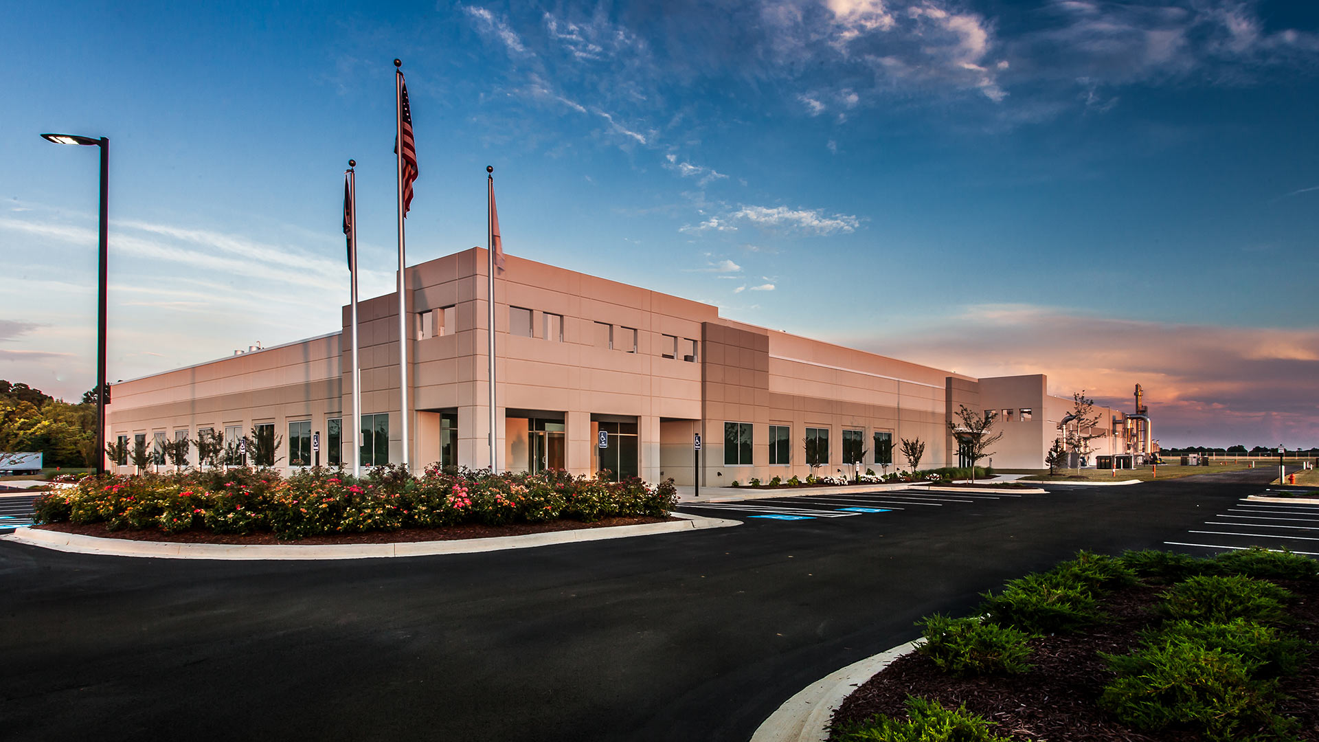 Exterior of tobacco processing facility|Interior of tobacco processing facility|Interior photo of tobacco processing facility mechanical equipment|Aerial photo of tobacco processing facility||||