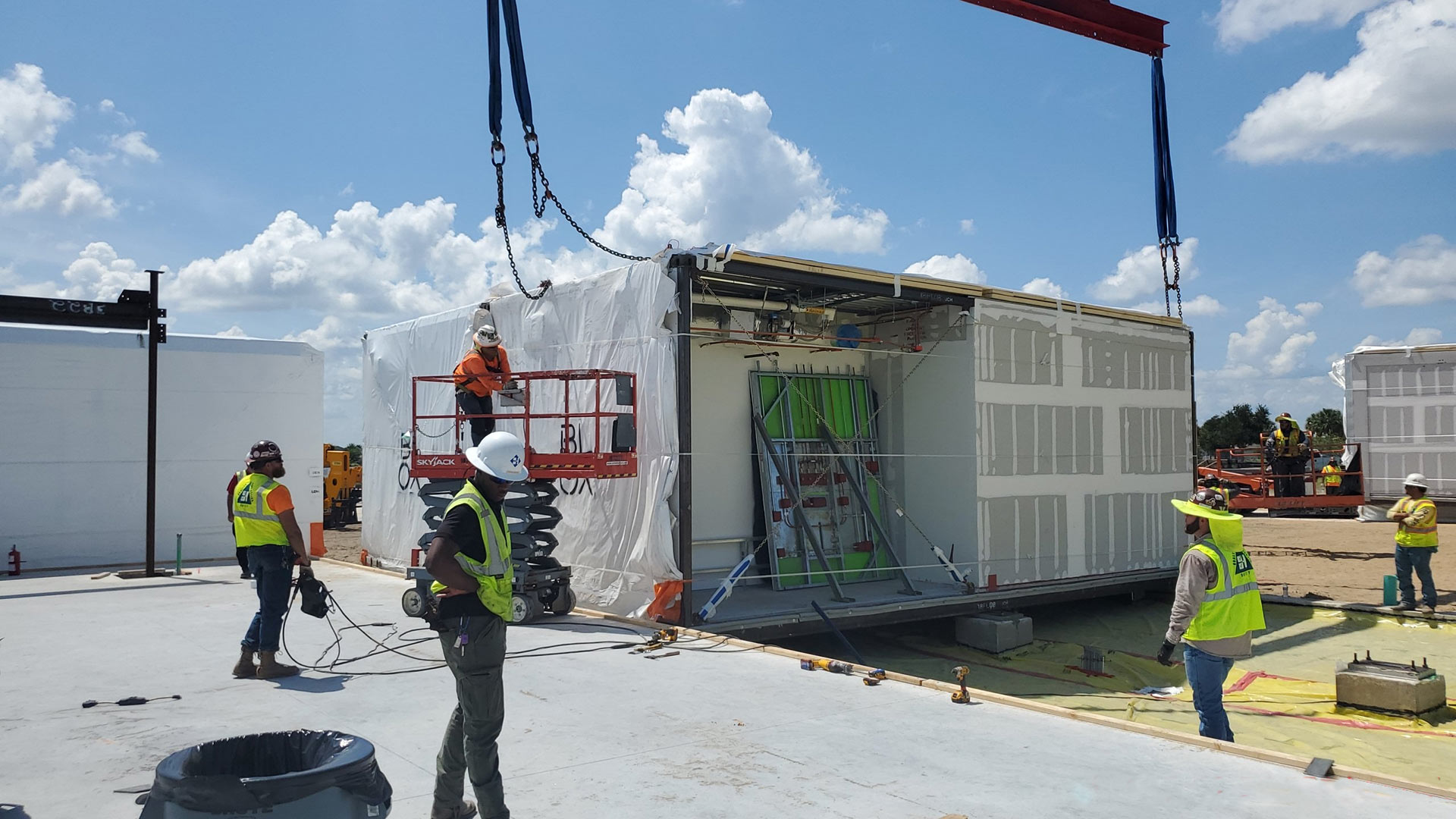 BLOX Uber Module being set on Trailwinds construction site|BLOX Uber Module being set on Trailwinds construction site|Exterior of Trailwinds Village|Interior of Trailwinds Village||||