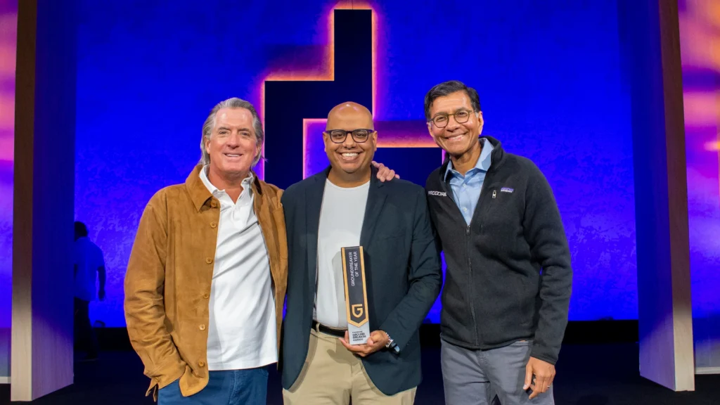 From left, Tooey Courtemanche, Procore Founder and CEO; Hamzah Shanbari, Haskell Director of Innovation and Disruption; and Ajei Gopal, succeeding Procore CEO, celebrate Shanbari’s recognition as Groundbreaker of the Year.