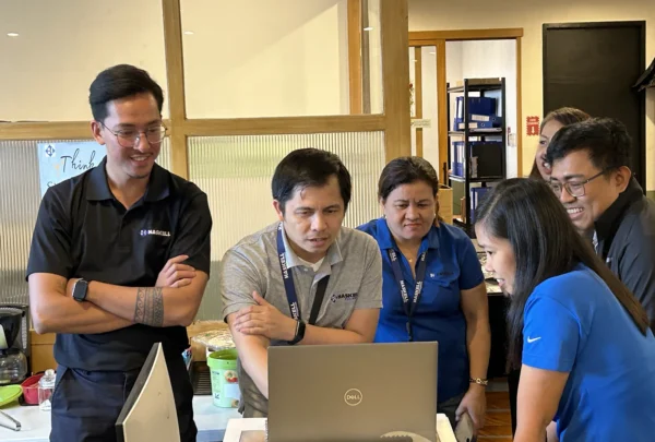 From left, Haskell’s Ralph Carig, BIM Integration Lead; Michael Lapena, Electrical Project Engineer; Leilannie Salvani, Senior HR Manager – APAC; Sheila Perez, BIM Specialist I (foreground); Ella Culubong (background), Philippines General Manager; and Leo Dino Buera, BIM Integration Manager, collaborate on a project design.