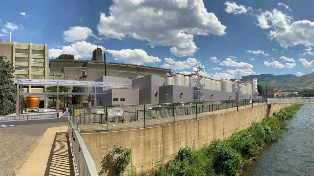 Exterior photo of industrial facility along river