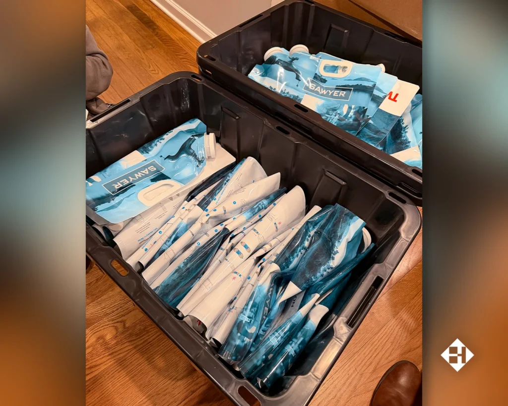 Water filters are packed into storage bins as the team prepares to travel to Venezuela.