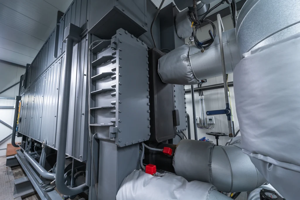An industrial absorption heat pump helps recover and reuse thermal energy within a power plant.