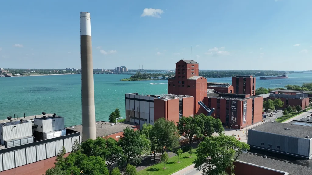 Aerial view of the Hiram Walker & Sons distillery complex along the Detroit River in Windsor, Ontario.